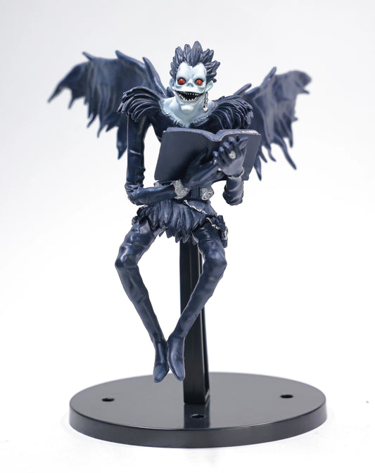 Ryuk holding Death Note