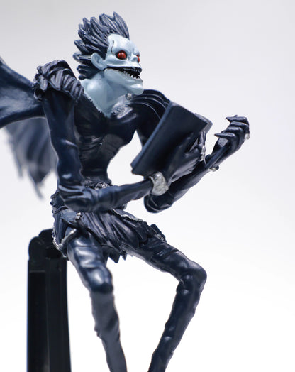 Ryuk holding Death Note