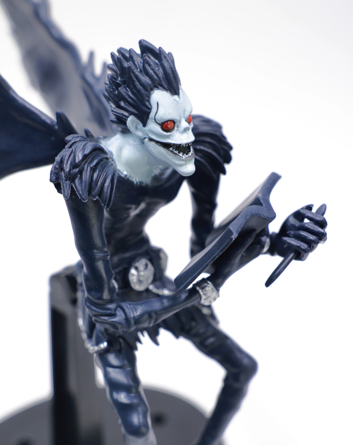 Ryuk holding Death Note