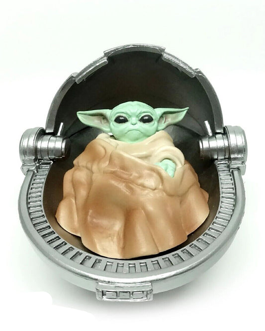 Baby Yoda in rocking Pod