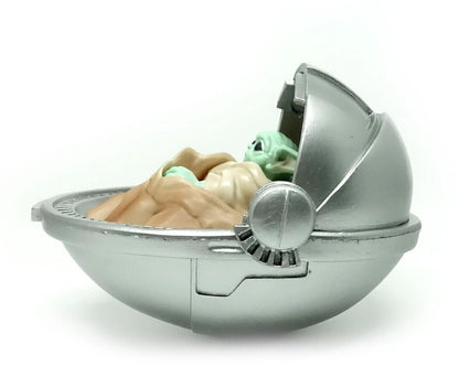 Baby Yoda in rocking Pod