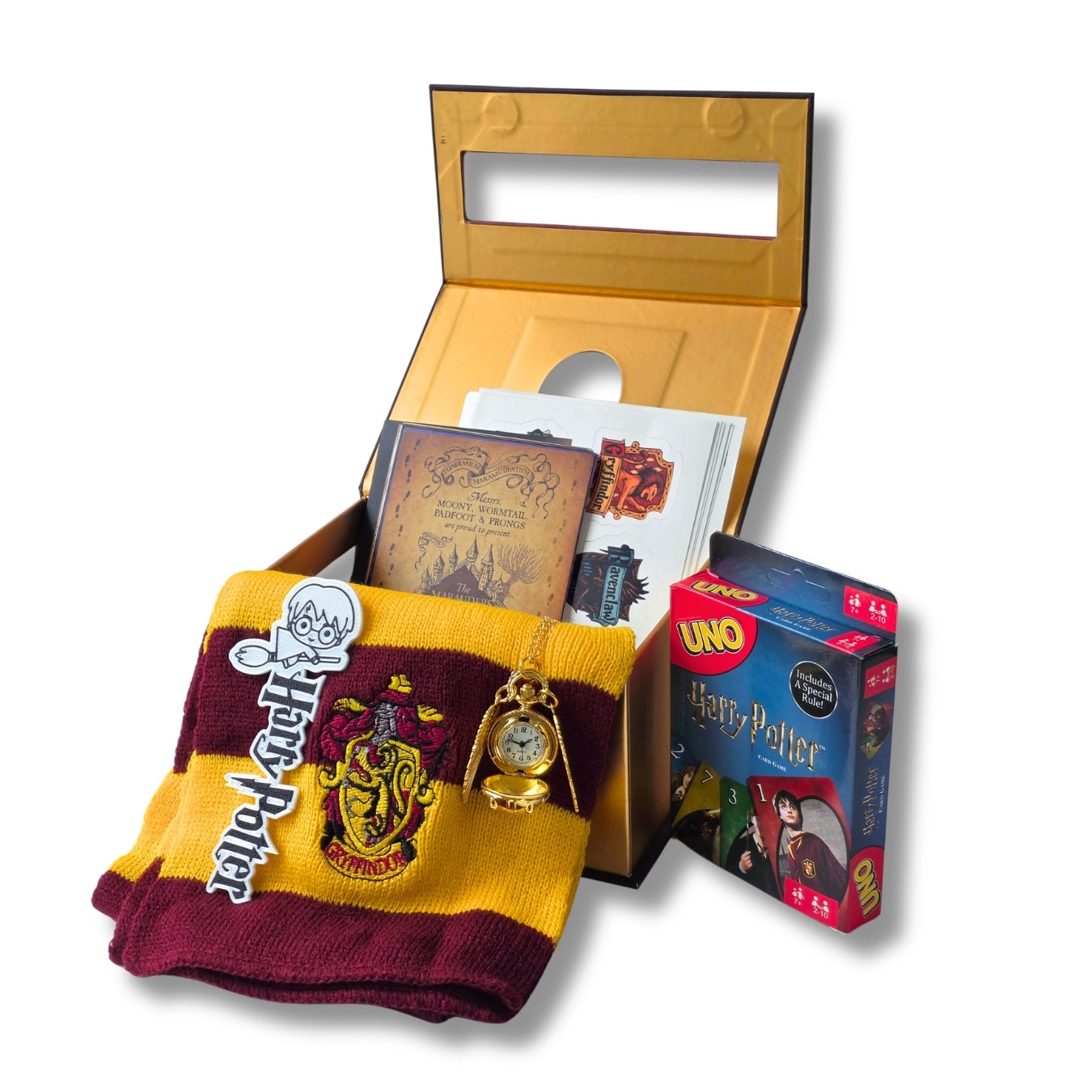 A Harry Potter themed gift set featuring a gold presentation box, maroon and gold socks with Gryffindor crest, a gold pocket watch charm, a map card, and a UNO Harry Potter card game box, all on a white background.